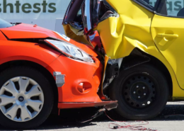 Rear-end collision between two vehicles showing significant crash damage.