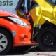 Rear-end collision between two vehicles showing significant crash damage.