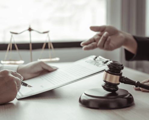 Portland car accident attorney meeting with a client to discuss legal options and personal injury claim after a crash.