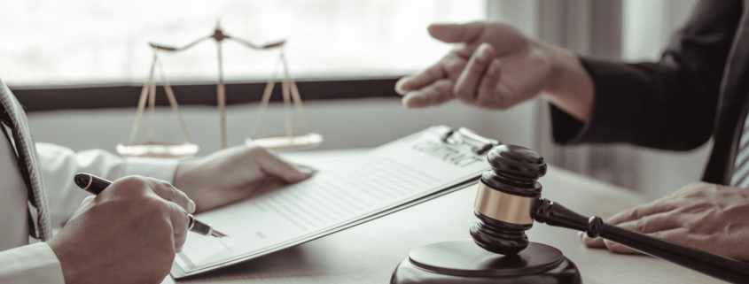 Portland car accident attorney meeting with a client to discuss legal options and personal injury claim after a crash.